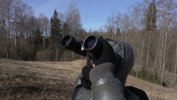 Woman Using Binoculars Outdoors — Stock Video