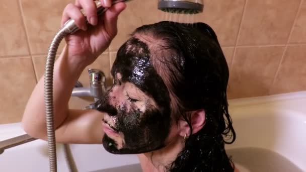 Woman Black Cleansing Cream Mask Washes Her Head Bathroom — Stock Video