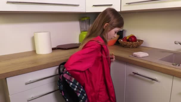 Little Girl Coming Home School Eating Cookie — Stock Video