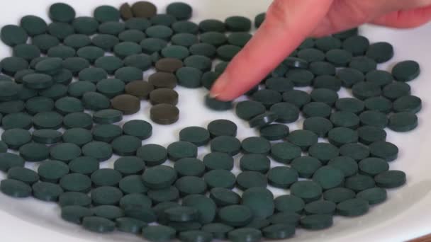 Woman Sorting Spirulina Pills Close — Stock Video