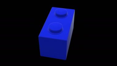 Siyah arka planda mavi renkte küçük dönen oyuncak tuğla