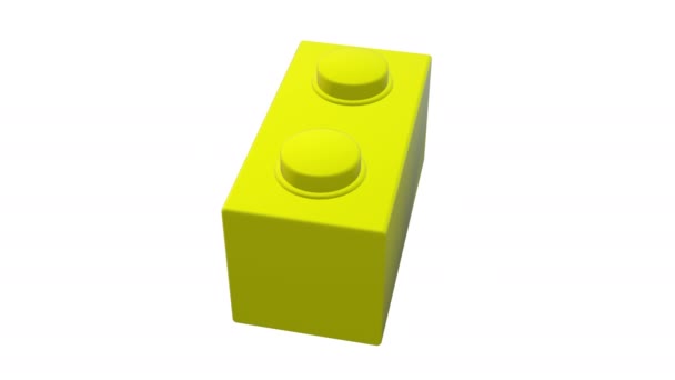 白色上黄色的小旋转玩具砖 — 图库视频影像