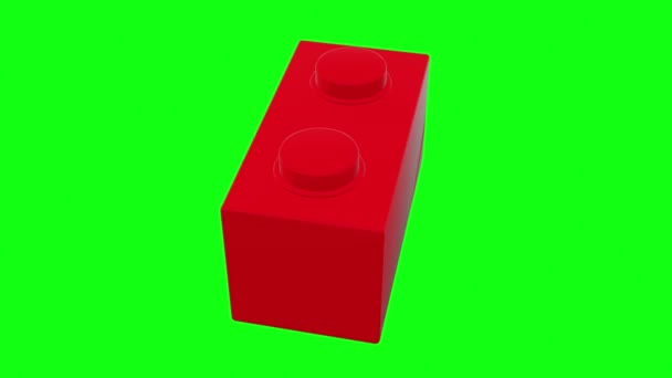 Pequeno Tijolo Brinquedo Rotativo Cor Vermelha Tela Verde — Vídeo de Stock
