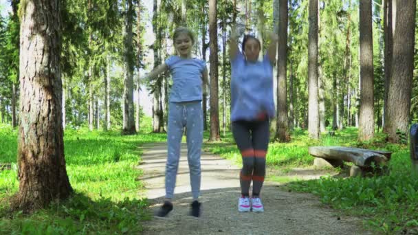 Mother Daughter Doing Jumping Jack Exercise — Stock Video