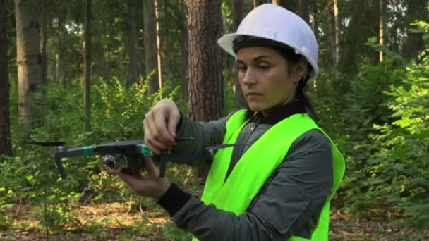 Woman Worker Prepares Drone Quadcopter Video Forest Inspection — ストック動画