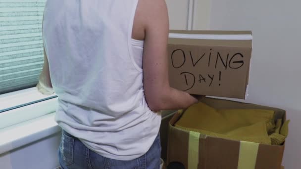 Woman Holding Box Words Moving Day — Stock Video