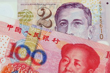 Görüntü iki Singapur Doları banka notunun yüz Çin Yuan banknot ile yakından