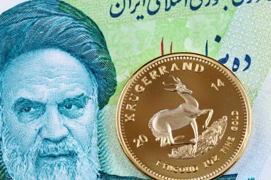 Altın bir Güney Afrika Kruger altını bir 10000 İran Riyali fatura ile makro görüntüsünü