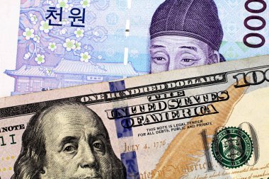 Not bir Güney Koreli bir thousad ile mavi bir Amerikan yüz dolarlık banknot bir makro görüntüsünü kazandı