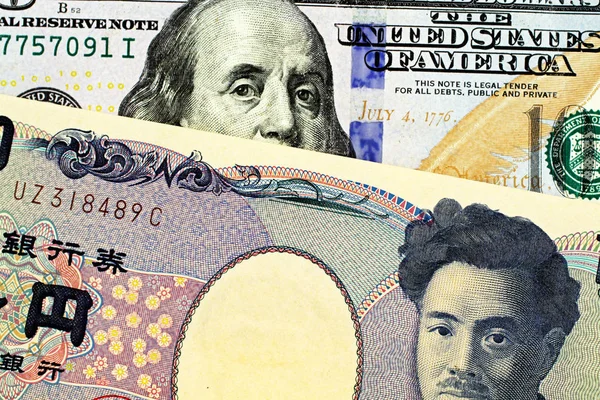 アメリカの100ドル紙幣を使った1000円の日本銀行紙幣のマクロイメージ — ストック写真