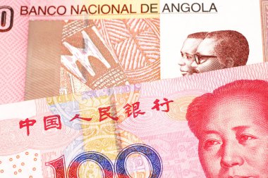 Kırmızı, Çin 100 yuan banknot makro yakın Angola renkli bir on kwanza faturası