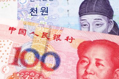 Güney Kore'den iki bin wonluk bir not, Çin Halk Cumhuriyeti'nden kırmızı, yüz yuan notla makroya yakın