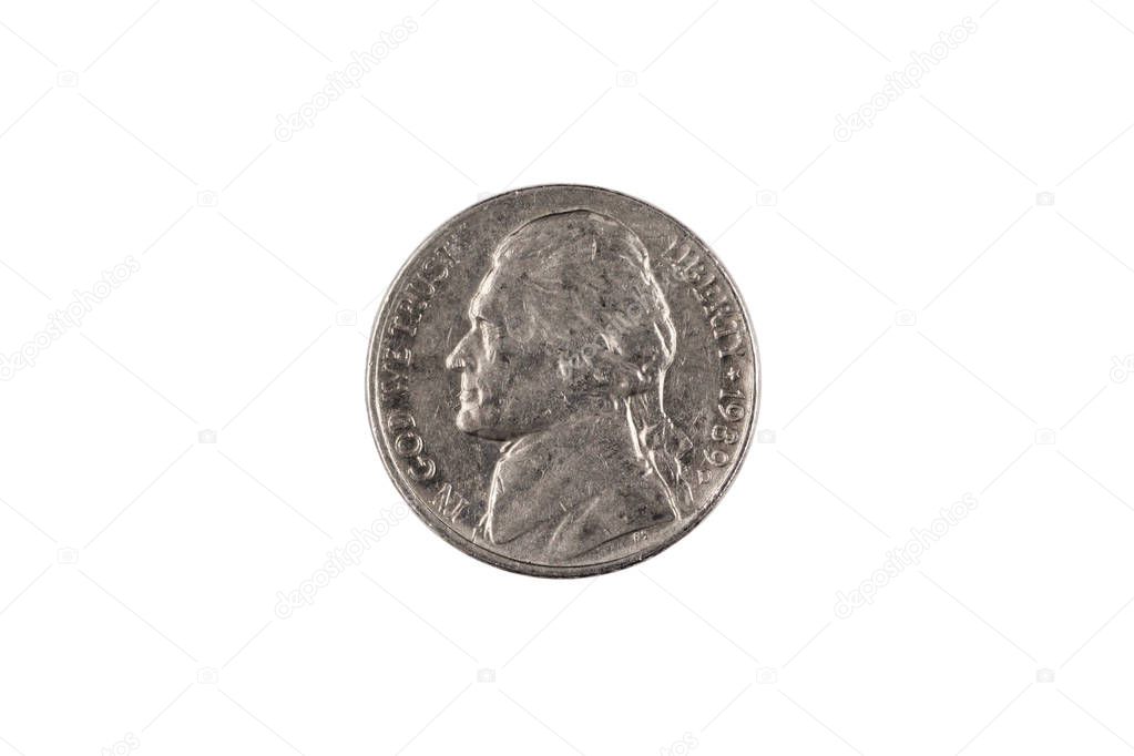 An American five cent nickel, close up in macro, against a clean, white background