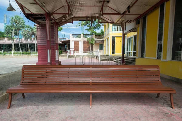 Wooden bench on old concrete floor.