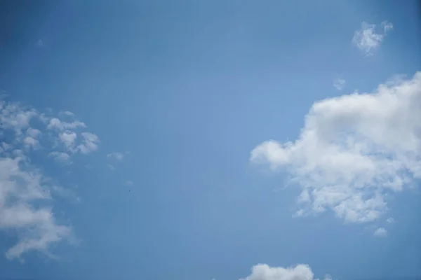 Bright summer light blue sky background with free form floating white cloud as per imagination on sunshine day, Turkey