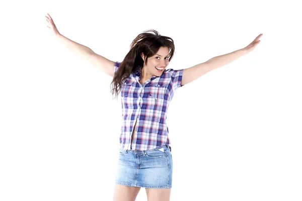 Joyeux jeune femme dans une chemise à carreaux avec les bras levés — Photo