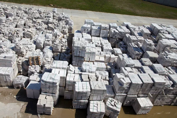 Aerial view of autoclaved aerated concrete blocks, both defective and good, on pallets, stored at factory warehouse — Stock Image Aerial view of autoclaved aerated concrete blocks, both defective and good, on pallets, stored at factory warehouse Royalty Free Stock Images