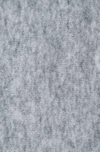 Grau warme Strickwaren glatte Textur. Nahaufnahme. Abstrakter Hintergrund. — Stockfoto