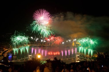 the 20th of August fireworks over Budapest Parliament, the Danube and chain bridge on St. Stephens or foundation day of Hungary clipart