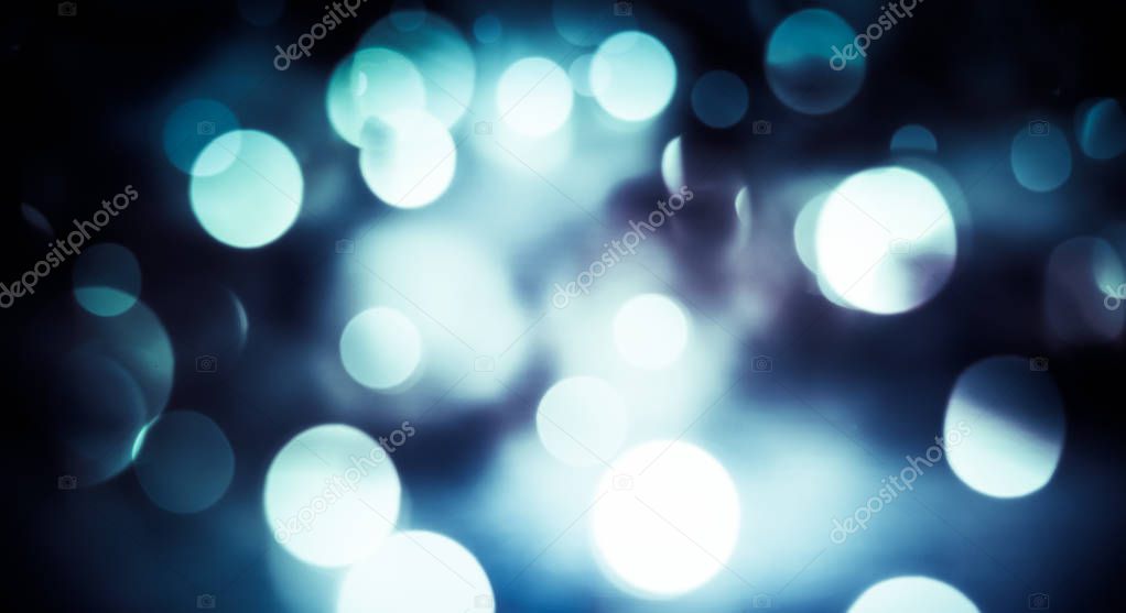 abstract Christmas background with holiday lights and copy space - magic bokeh glitter with blinking stars and falling snowflakes