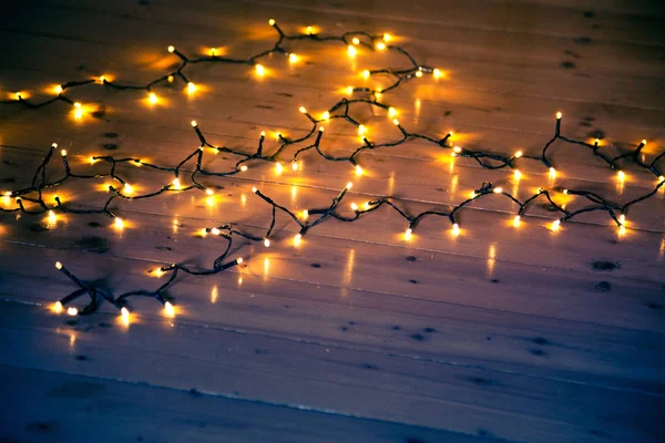 Luces Navidad Sobre Fondo Madera —  Fotos de Stock