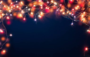 mavi arka plan üzerinde renkli Noel ışıkları