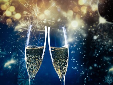 two champagne glasses ready to bring in the New Year clipart
