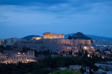 athens seen from Philopapou hill with views to Herodium , Acropolis and the Parthenon at blue hour, Attica, Greece clipart