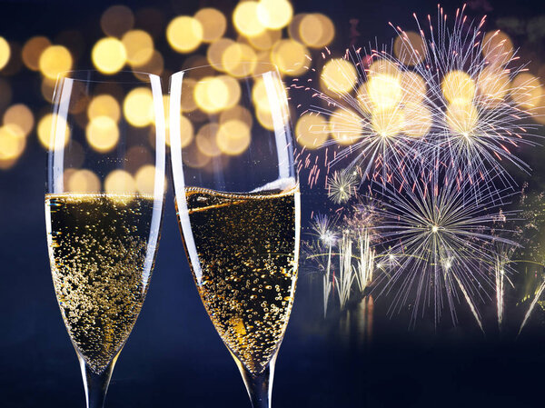 two champagne glasses ready to bring in the New Year