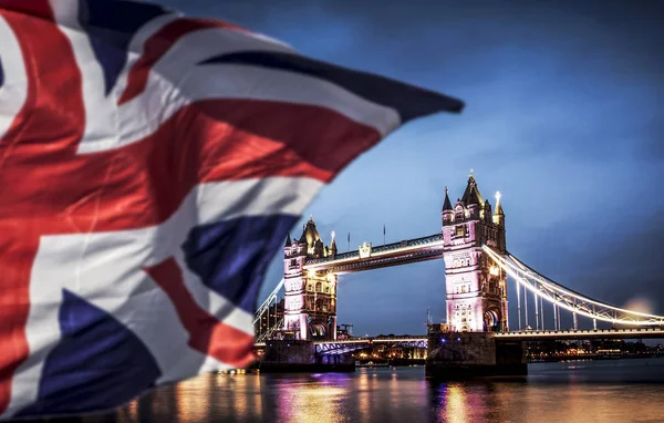 brexit concept - double exposure of Tower bridge and flags