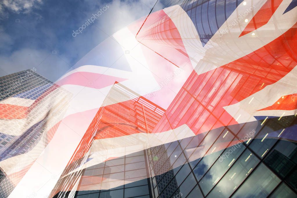 brexit concept - UK economy after Brexit deal - double exposure of flag and Canary Wharf business center skyscrapers