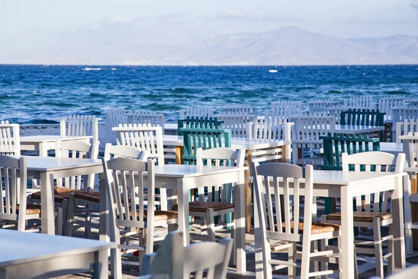 restaurant chairs and tables by the sea