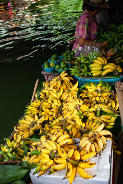 floating market - top view of boat full of fresh fruits on sale