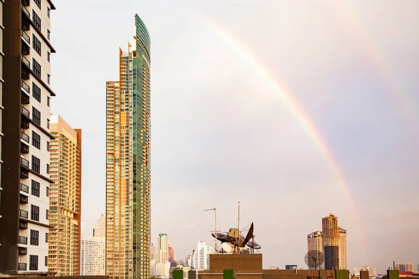 Skyscrapers and BTS in Bangkok against rainbow sky — Stock Photo, Image