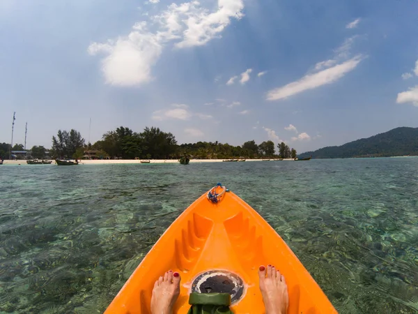 kayaking in crystal clear tropical waters - kayak heading to is