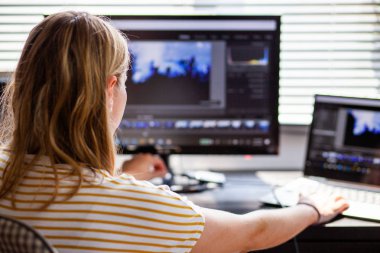 woman daydreaming while working on laptop in home office, social media influence 