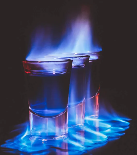 Burning drink in shot glass — Stock Photo, Image