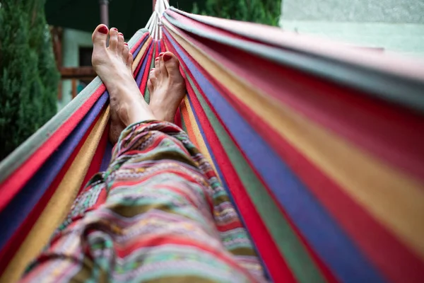 woman feet relaxing in hammock summer zen