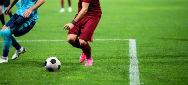 Futbol oyuncularının futbol için savaştığı pankart