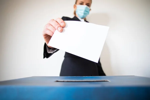 Woman Wearing Mask Putting Vote Ballot — Stock Photo, Image