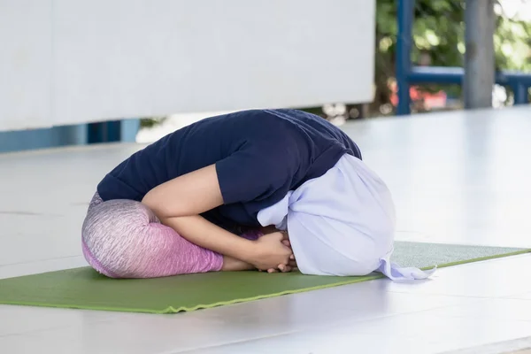 Asian muslim yoga experts women are showing the correct posture