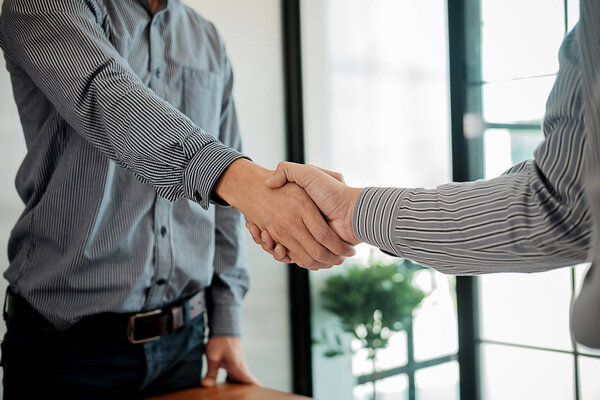 Business confident handshake and business people after discussing , success  concept