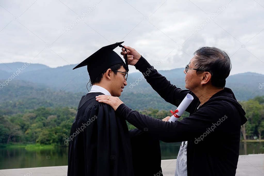happy man on her graduation day University. student in graduation cap with certificate. Education and people.