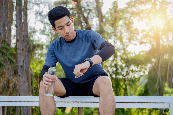 Sport watch run woman checking smartwatch tracker.