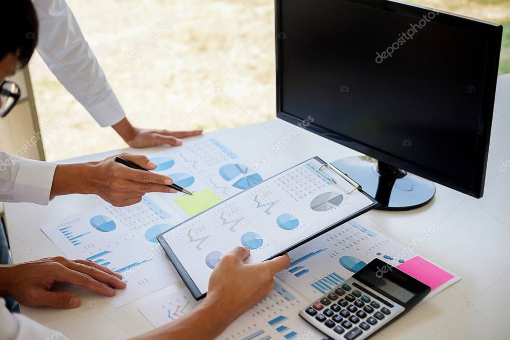 Business adviser analyzing financial figures denoting the progress Internal Revenue Service checking document. Audit concept