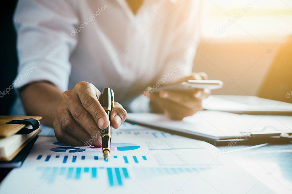 Administrator business man financial inspector and secretary making report calculating balance. Internal Revenue Service checking document. Audit concept