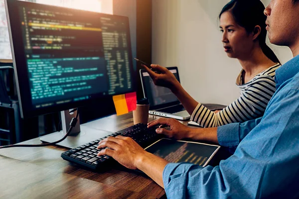 Programmer working in a software development and coding technolo — Stock Photo, Image