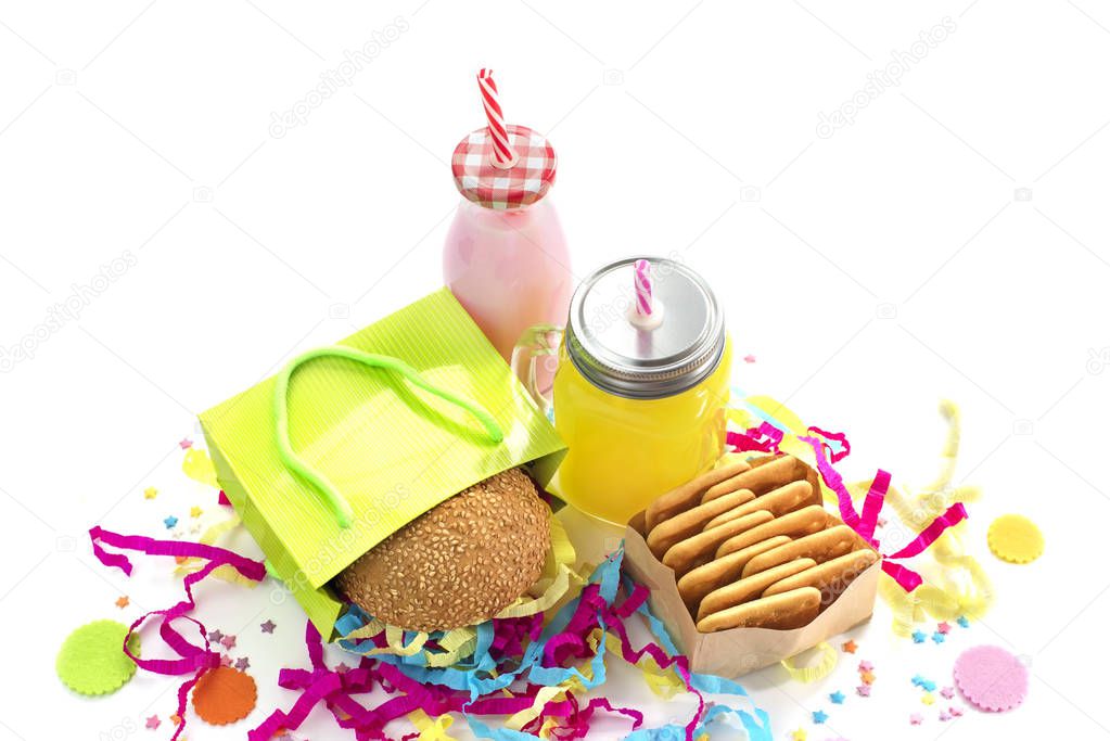 Festive composition drinks snacks holiday hamburger cookie tinsel confetti gift box cocktail saturated colors. Children's holiday birthday party