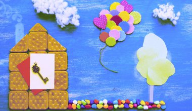 Surealism concept of a cookie house on a wooden blue sky cloud background family path. Top view Flat lay clipart