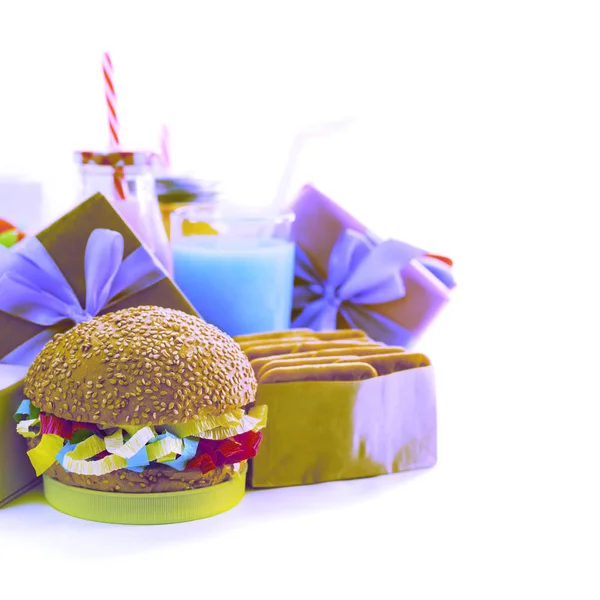 Surrealusm Festive composition drinks snacks holiday hamburger cookie tinsel confetti gift box cocktail cactus saturated colors. Children's holiday birthday party